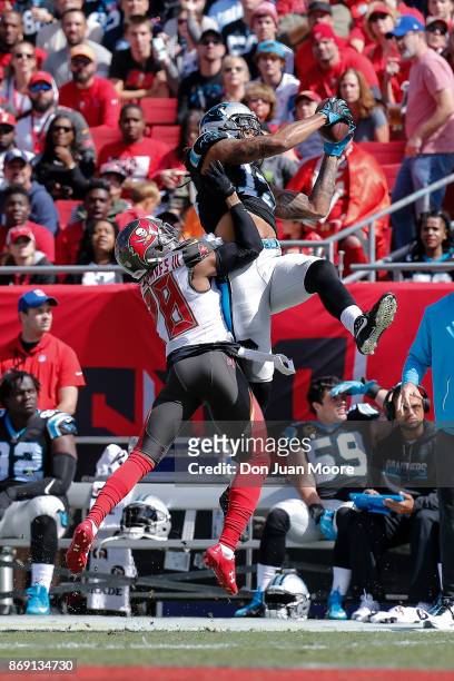 Wide Receiver Kelvin Benjamin of the Carolina Panthers makes a catch out of bounce against Cornerback Vernon Hargreaves of the Tampa Bay Buccaneers...