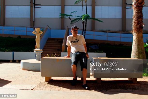 Luis Diaz sits in the school playground in Barranquitas, Puerto Rico October 31, 2017. Twenty people from Barranquitas have been living for the past...