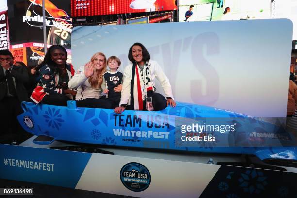 Bobsledders Aja Evans, Jamie Greubel Poser and Elana Meyers Taylor pose for a photo in a bobsled during the 100 Days Out 2018 PyeongChang Winter...