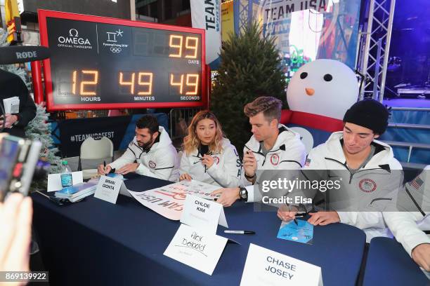 Ice hockey player Brian Gionta and snowboarders Chloe Kim, Alex Deibold and Chase Josey sign autographs during the 100 Days Out 2018 PyeongChang...
