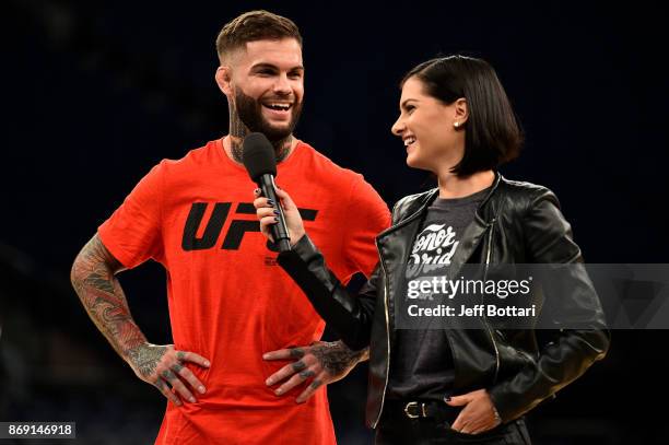 Bantamweight Champion Cody Garbrandt and UFC host Megan Olivi interact with fans and media inside Madison Square Garden on November 1, 2017 in New...