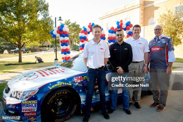 Gordy Sheer, Austin Dillon, Sam Crabtree and Neal Smatresk unveil the new DOW 2018 Winter Olympic paint scheme at the University of North Texas on...