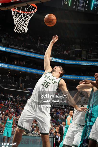 Mirza Teletovic of the Milwaukee Bucks goes to the basket against the Charlotte Hornets on November 1, 2017 at Spectrum Center in Charlotte, North...