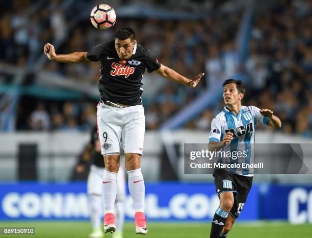 Oscar Cardozo of Libertad heads the ball during a second leg match between Racing Club and Libertad as part of the quarter finals of Copa CONMEBOL...