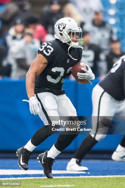 DeAndre Washington of the Oakland Raiders warms up before the game against the Buffalo Bills at New Era Field on October 29, 2017 in Orchard Park,...