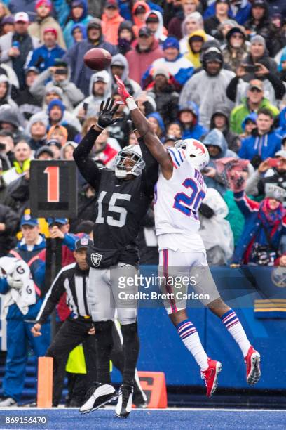 Shareece Wright of the Buffalo Bills breaks up a pass intended for Michael Crabtree of the Oakland Raiders at New Era Field on October 29, 2017 in...