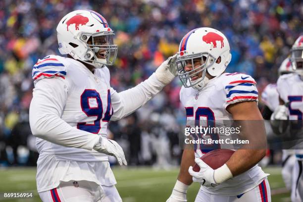 Matt Milano of the Buffalo Bills celebrates returning a fumble for a touchdown during the game against the Oakland Raiders at New Era Field on...