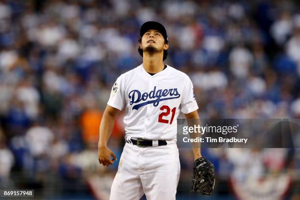 Yu Darvish of the Los Angeles Dodgers reacts in the first inning against the Houston Astros in game seven of the 2017 World Series at Dodger Stadium...