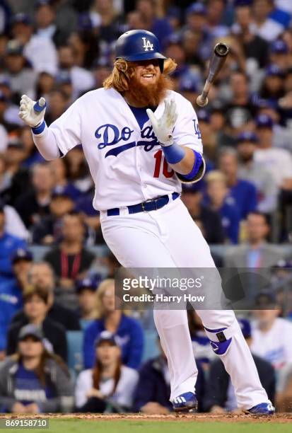 Justin Turner of the Los Angeles Dodgers reacts after getting hit by a pitch in the first inning against the Houston Astros in game seven of the 2017...