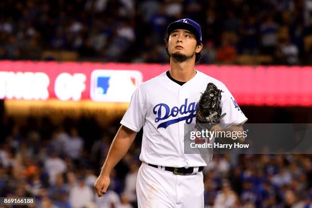 Yu Darvish of the Los Angeles Dodgers walks to the dugout after being relieved during the second inning against the Houston Astros in game seven of...