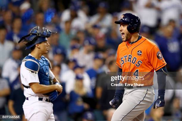 George Springer of the Houston Astros celebrates after hitting a two-run home run during the second inning against the Los Angeles Dodgers in game...