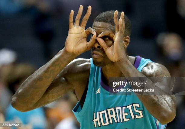 Marvin Williams of the Charlotte Hornets reacts after making a basket against the Milwaukee Bucks during their game at Spectrum Center on November 1,...