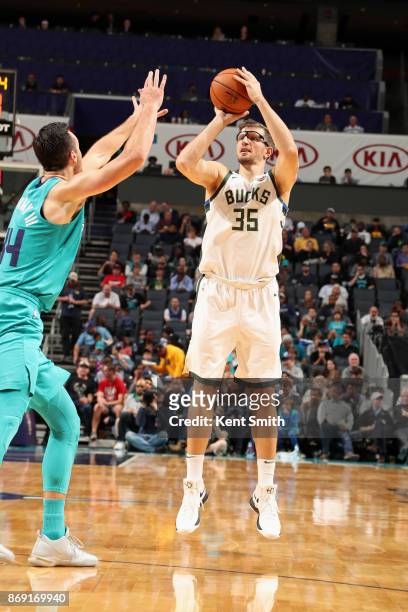 Mirza Teletovic of the Milwaukee Bucks shoots the ball against the Charlotte Hornets on November 1, 2017 at Spectrum Center in Charlotte, North...