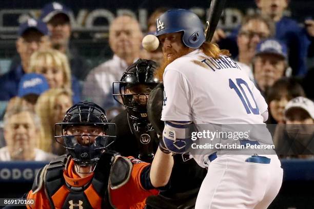 Justin Turner of the Los Angeles Dodgers is hit by a pitch during the third inning against the Houston Astros in game seven of the 2017 World Series...