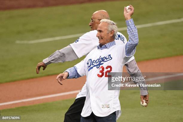 Former Los Angeles Dodgers players Don Newcombe and Sandy Koufax throw out the ceremonial first pitch before game seven of the 2017 World Series...