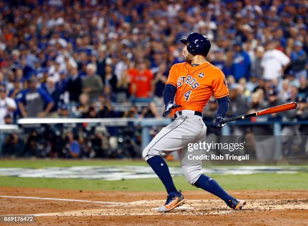 George Springer of the Houston Astros hits a two-run home run in the second inning of Game 7 of the 2017 World Series against the Los Angeles Dodgers...