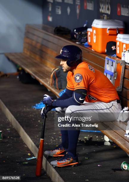 George Springer of the Houston Astros sits in the dugout during Game 7 of the 2017 World Series against the Los Angeles Dodgers at Dodger Stadium on...