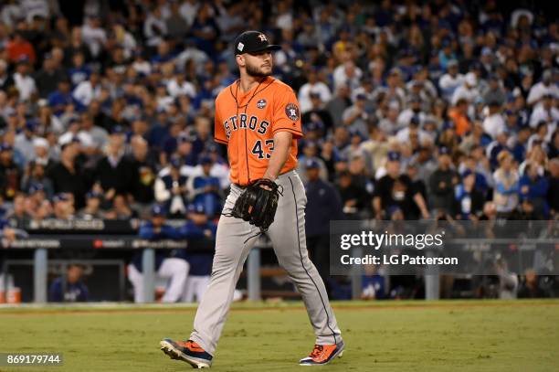 Lance McCullers Jr. #43 of the Houston Astros walks back to the dugout after being removed from the game in the third inning during Game 7 of the...
