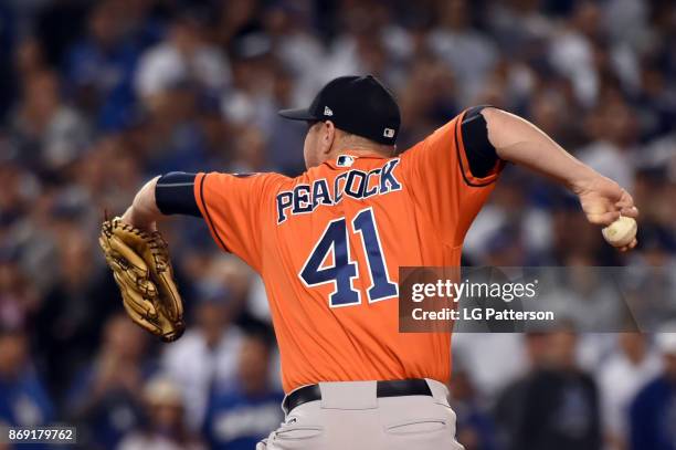 Brad Peacock of the Houston Astros pitches during Game 7 of the 2017 World Series against the Los Angeles Dodgers at Dodger Stadium on Wednesday,...