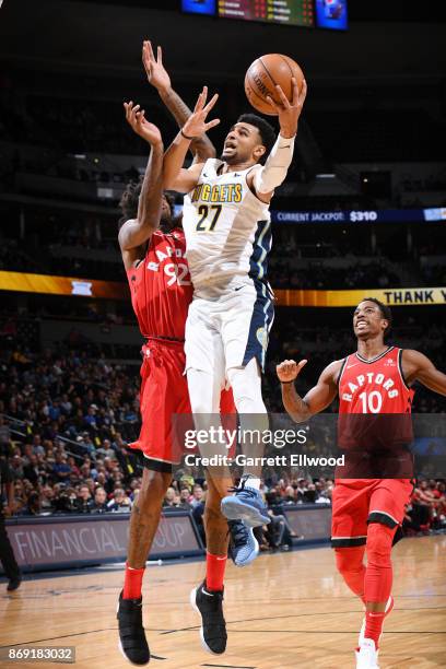 Jamal Murray of the Denver Nuggets drives to the basket against the Toronto Raptors on November 1, 2017 at the Pepsi Center in Denver, Colorado. NOTE...