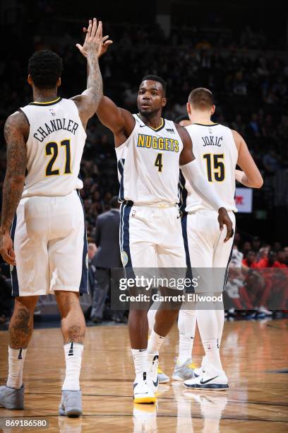 Paul Millsap of the Denver Nuggets gives high five to Wilson Chandler of the Denver Nuggets during the game against the Toronto Raptors on November...