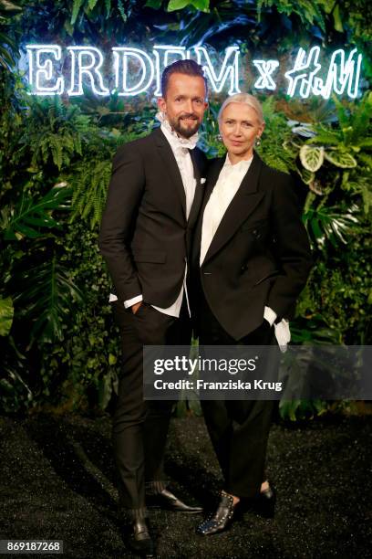 Thorsten Mindermann and Christiane Arp wearing ERDEM X H&M attend the ERDEM x H&M Pre-Shopping Event on November 1, 2017 in Berlin, Germany.