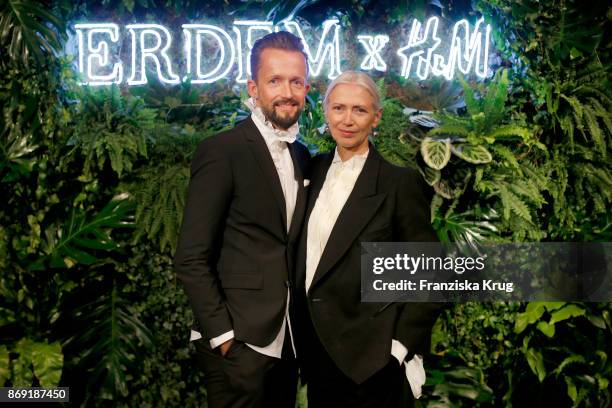 Thorsten Mindermann and Christiane Arp wearing ERDEM X H&M attend the ERDEM x H&M Pre-Shopping Event on November 1, 2017 in Berlin, Germany.