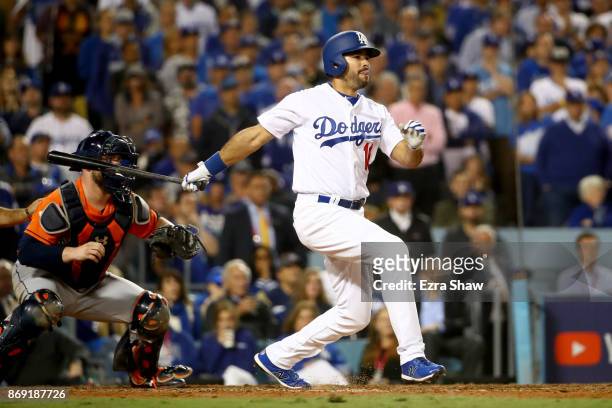 Andre Ethier of the Los Angeles Dodgers hits a RBI single to score Joc Pederson during the sixth inning against the Houston Astros in game seven of...
