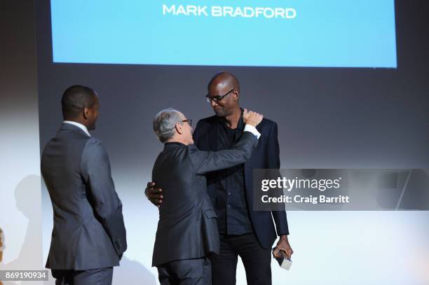 Director of MoMA Glenn Lowry presents an award onstage to artist Mark Bradford during the WSJ. Magazine 2017 Innovator Awards at MOMA on November 1,...