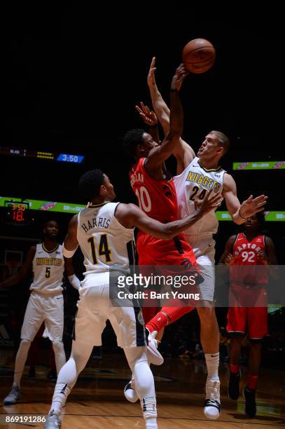 DeMar DeRozan of the Toronto Raptors and Richard Jefferson of the Denver Nuggets vie for the ball during the game on November 1, 2017 at the Pepsi...