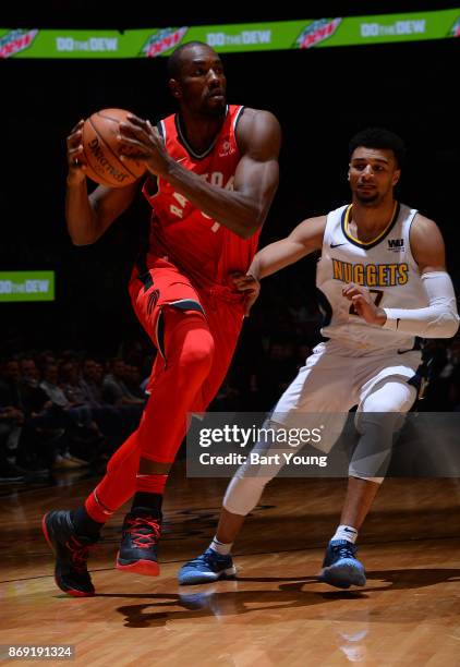 Serge Ibaka of the Toronto Raptors handles the ball against the Denver Nuggets on November 1, 2017 at the Pepsi Center in Denver, Colorado. NOTE TO...