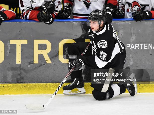 Tobie Paquette-Bisson of the Blainville-Boisbriand Armada falls to the ice against the Drummondville Voltigeurs during the QMJHL game at Centre...