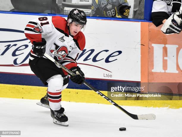 Xavier Simoneau of the Drummondville Voltigeurs skates the puck against the Blainville-Boisbriand Armada during the QMJHL game at Centre d'Excellence...