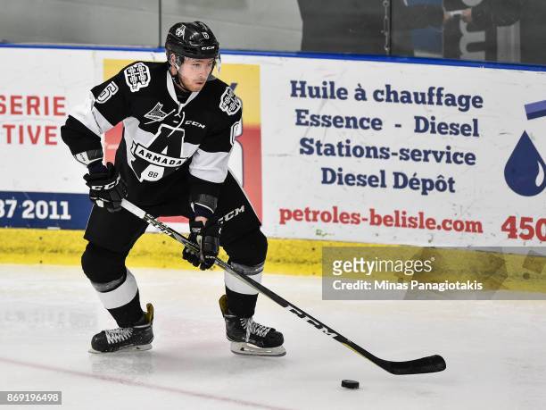 Antoine Crete-Belzile of the Blainville-Boisbriand Armada skates the puck against the Drummondville Voltigeurs during the QMJHL game at Centre...