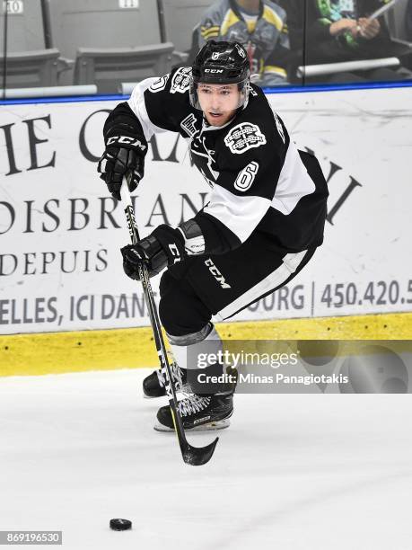 Antoine Crete-Belzile of the Blainville-Boisbriand Armada skates the puck against the Drummondville Voltigeurs during the QMJHL game at Centre...