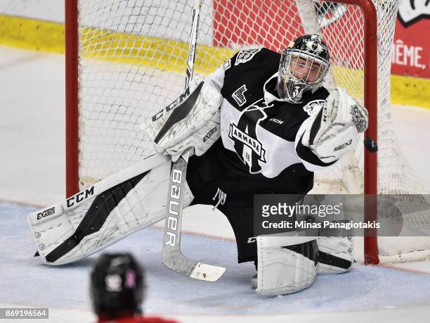 Francis Leclerc of the Blainville-Boisbriand Armada makes a save against the Drummondville Voltigeurs during the QMJHL game at Centre d'Excellence...