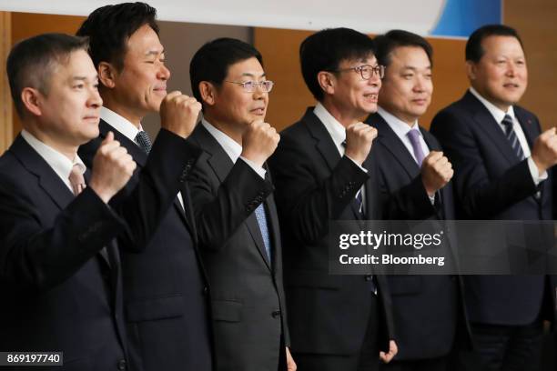 Ha Hyun-hwoi, president of LG Corp., from left, Park Jung-ho, president and chief executive officer of SK Telecom Co., Lee Sang-hoon, president at...