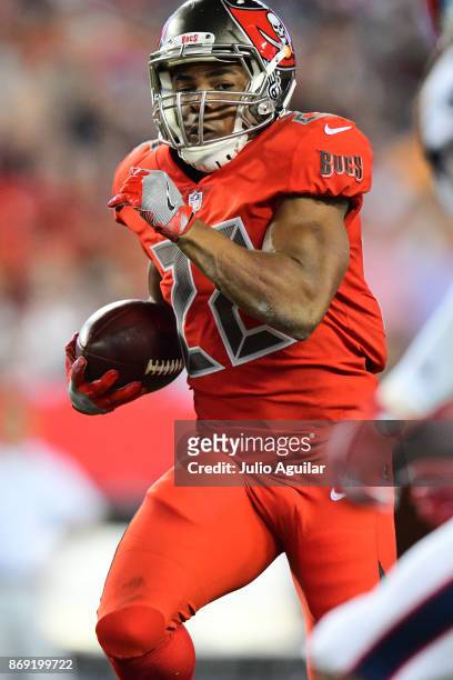 Running back Doug Martin of the Tampa Bay Buccaneers looks for yardage against the New England Patriots on October 5, 2017 at Raymond James Stadium...