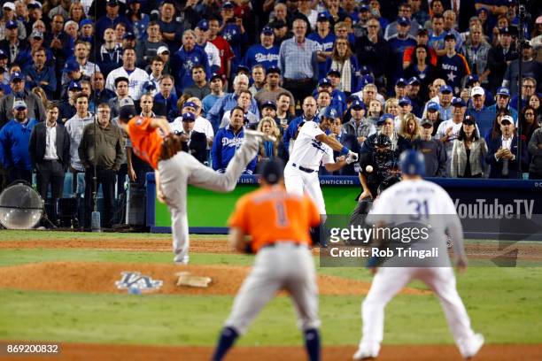 Andre Ethier of the Los Angeles Dodgers hits an RBI single in the sixth inning during Game 7 of the 2017 World Series against the Houston Astros at...