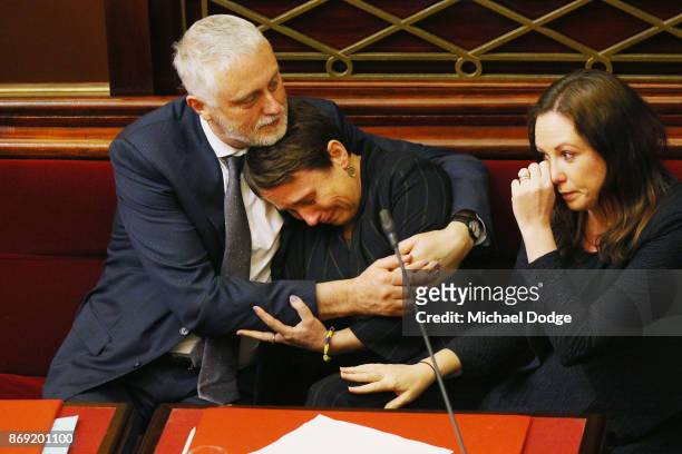 Labor MP Jaala Pulford is hugged by Gavin Jennings MP while crying after speaking about the loss of her daughter on November 2, 2017 in Melbourne,...