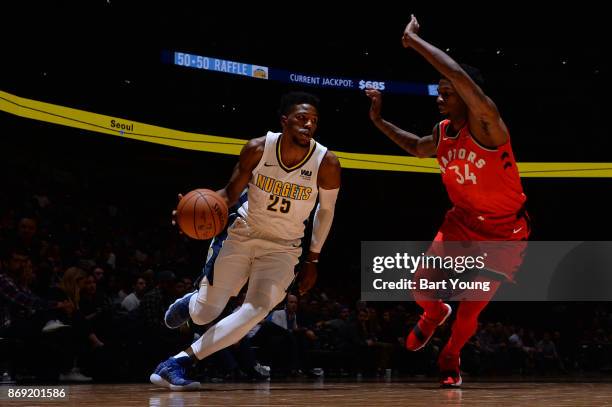 Malik Beasley of the Denver Nuggets handles the ball against the Toronto Raptors on November 1, 2017 at the Pepsi Center in Denver, Colorado. NOTE TO...