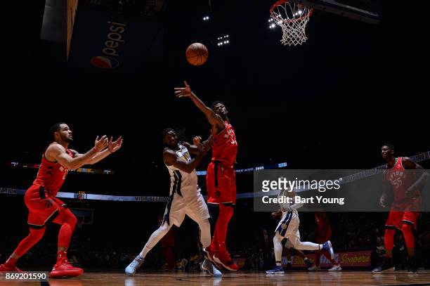 Alfonzo McKinnie of the Toronto Raptors passes the ball against the Denver Nuggets on November 1, 2017 at the Pepsi Center in Denver, Colorado. NOTE...