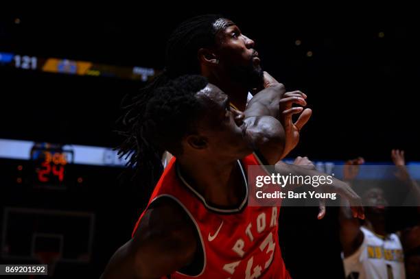 Pascal Siakam of the Toronto Raptors and Kenneth Faried of the Denver Nuggets await the ball during the game on November 1, 2017 at the Pepsi Center...