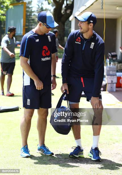 Steve Finn of England speaks to England fast-bowling consultant Shane Bond after Finn injured his knee during an England nets session at Richardson...