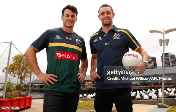 Robbie Tarrant of the Kangaroos and Jack Gunston of the Hawks pose for a photograph during a Australia International Rules Media Opportunity at AFL...