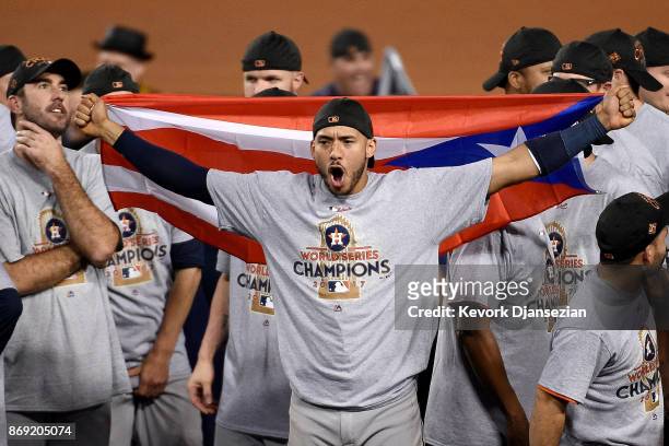 Carlos Correa of the Houston Astros celebrates defeating the Los Angeles Dodgers 5-1 in game seven to win the 2017 World Series at Dodger Stadium on...