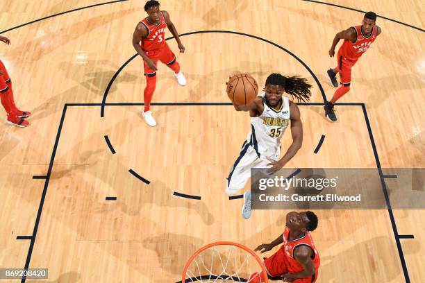 Kenneth Faried of the Denver Nuggets drives to the basket against the Toronto Raptors on November 1, 2017 at the Pepsi Center in Denver, Colorado....