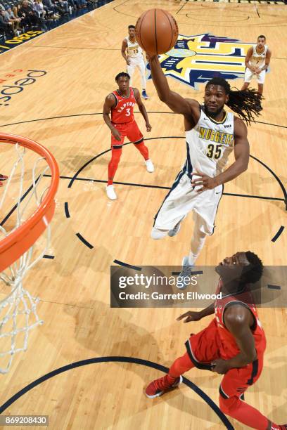 Kenneth Faried of the Denver Nuggets drives to the basket against the Toronto Raptors on November 1, 2017 at the Pepsi Center in Denver, Colorado....