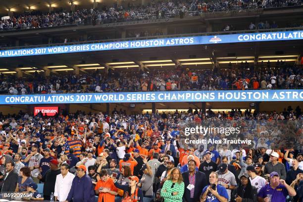 Houston Astros fans are seen cheering after the Astros defeated the Los Angeles Dodgers in Game 7 of the 2017 World Series at Dodger Stadium on...