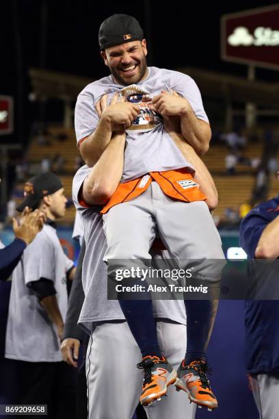 Jose Altuve of the Houston Astros celebrates with teammates after the Astros defeated the Los Angeles Dodgers in Game 7 of the 2017 World Series at...